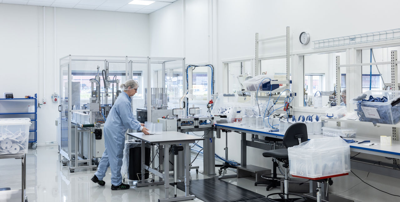 Person working in a cleanroom.
